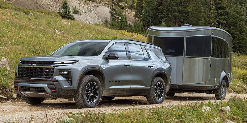 2026 Chevrolet Traverse towing trailer along Highway 99 near Bakersfield, CA demonstrating capability for boats, trailers, and outdoor adventures.